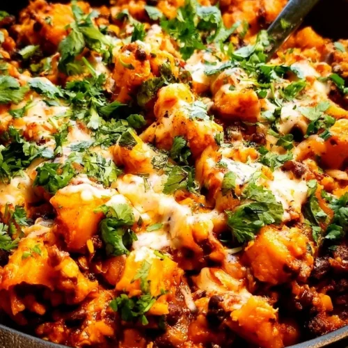 Butternut Squash and Black Bean Enchilada Skillet served in a cast iron pan