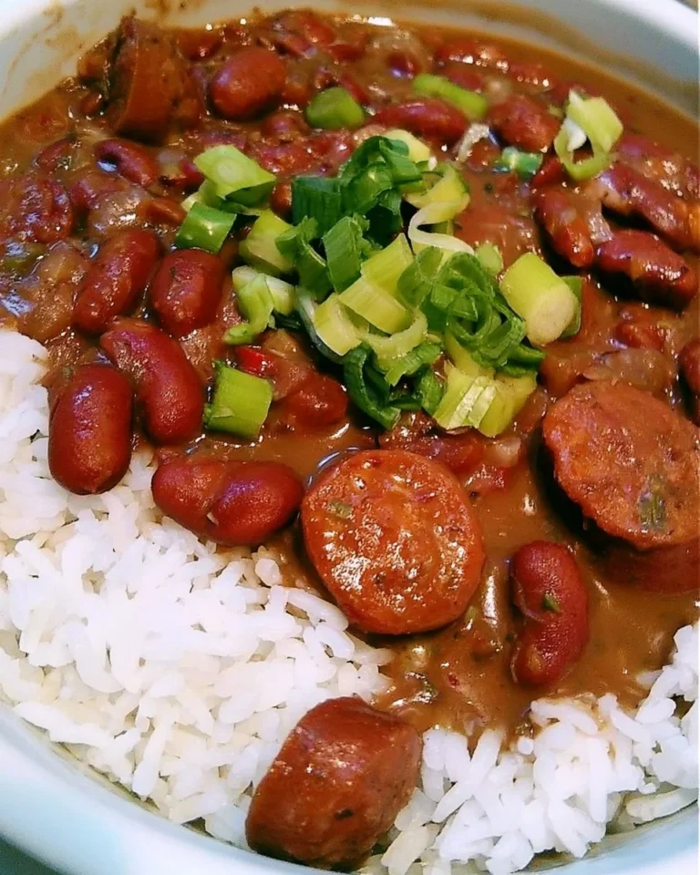 Crock-Pot Cajun Red Beans and Rice served in a bowl with spices and garnishes
