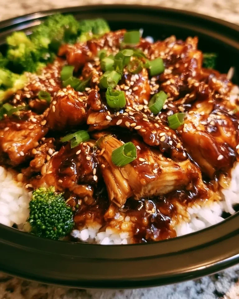 Delicious Crockpot teriyaki chicken served with rice and vegetables