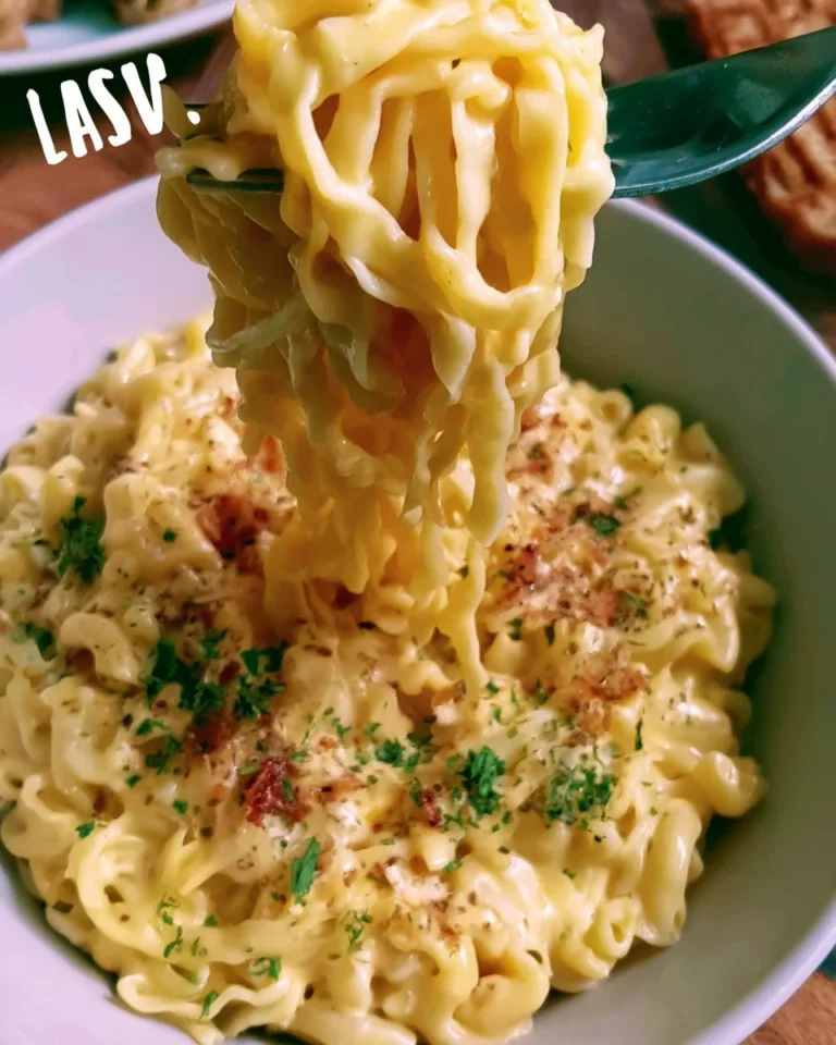 Homemade egg pasta being prepared on a wooden surface with flour and eggs.