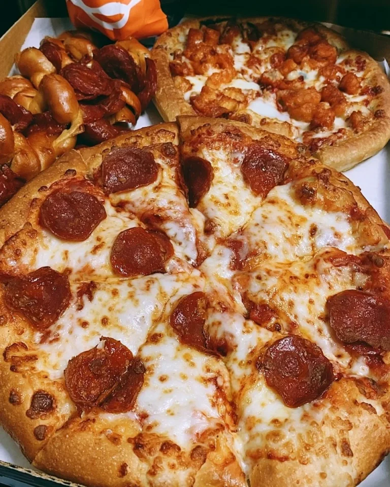 Aesthetic photo of Little Caesars Pizza by the Foot showcasing delicious toppings.