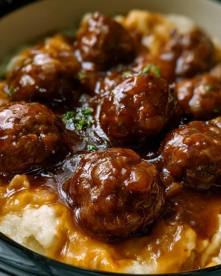 Slow Cooker Salisbury Steak Meatballs served with mashed potatoes and gravy