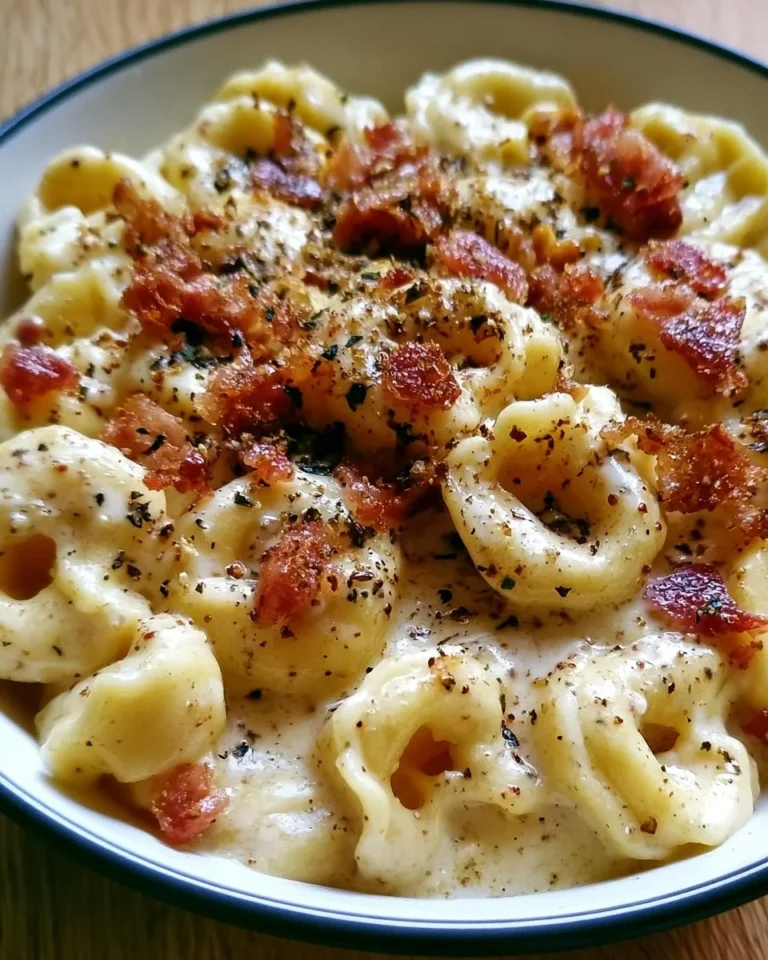 Creamy Tortellini Carbonara with sauce served in a bowl