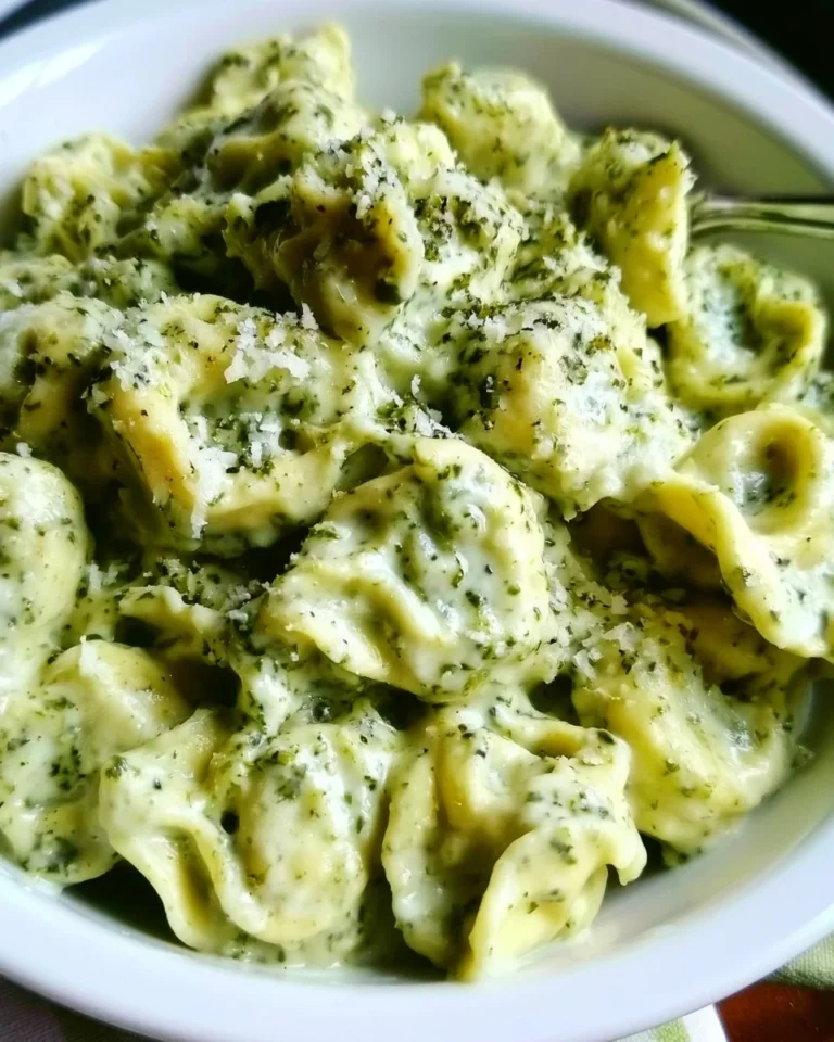 Delicious tortellini served with pesto and creamy alfredo sauce