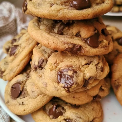 Freshly baked chocolate chip cookies on a cooling rack